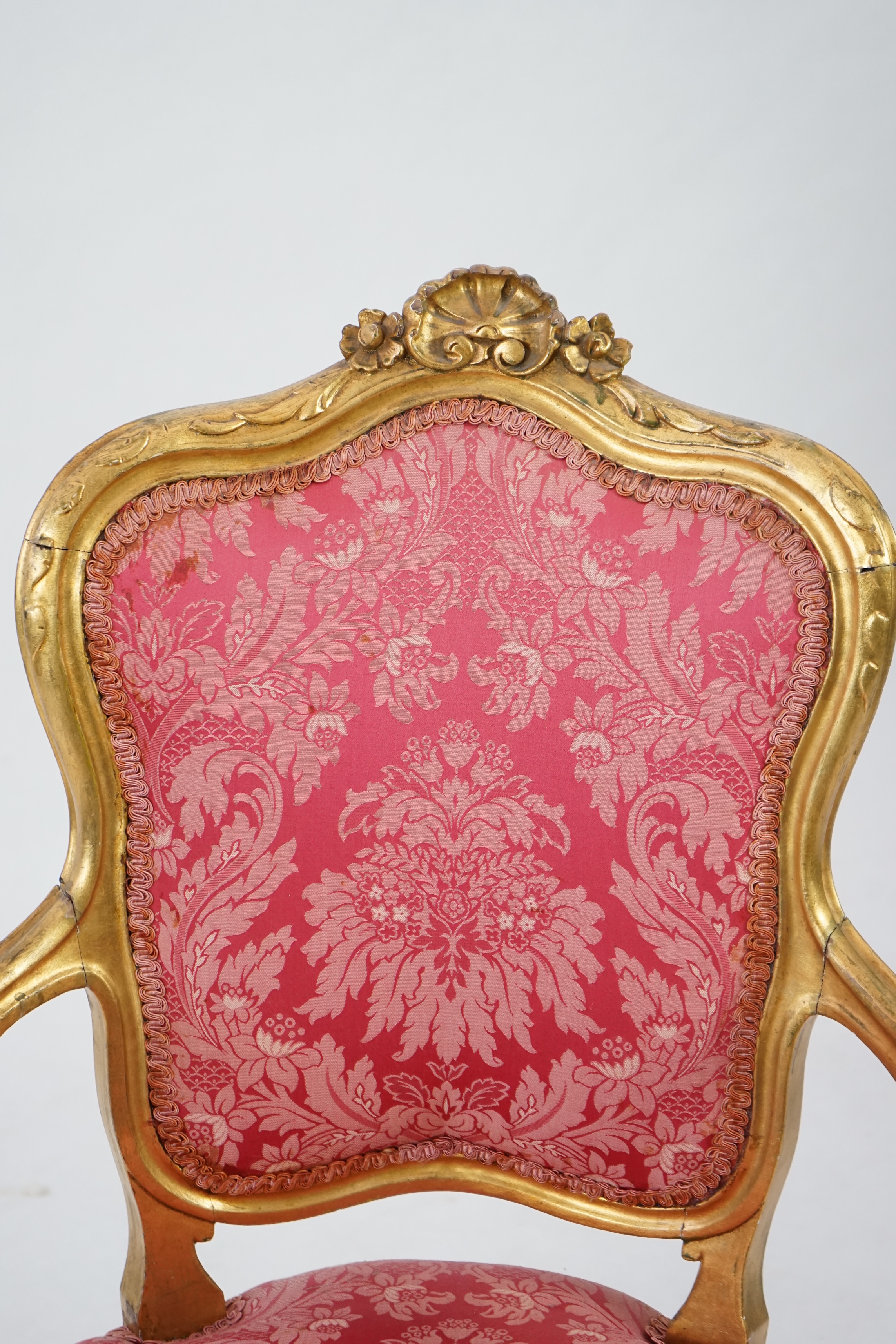 A Louis XV style carved giltwood fauteuil